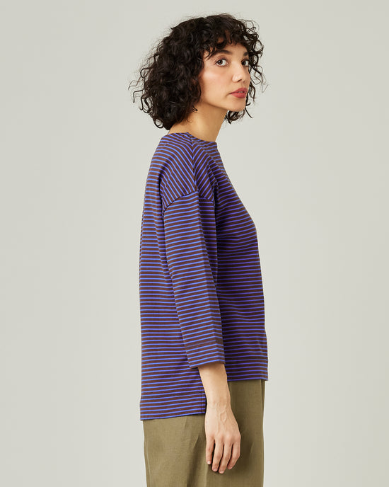 model wears blue and brown stripe breton top 