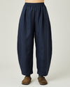 model wears navy linen daisy trousers front