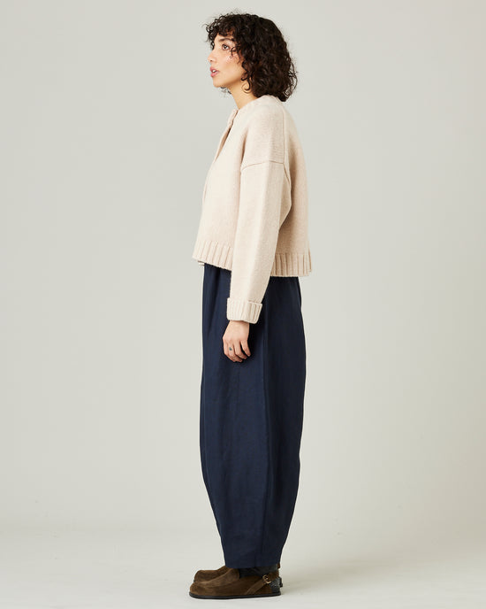 model wears navy linen daisy trousers 