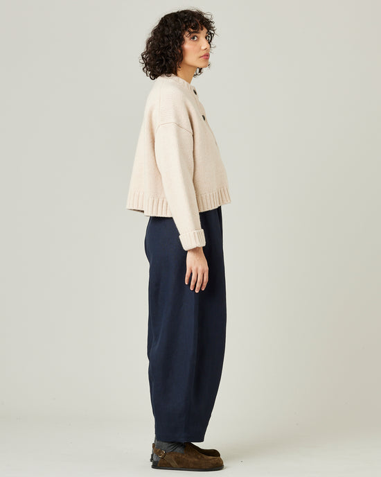 model wears navy linen daisy trousers 