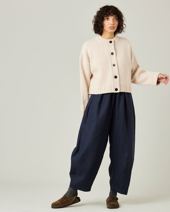 model wears navy linen daisy trousers 