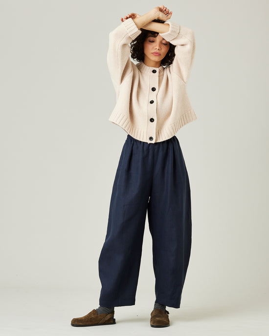 model wears navy linen daisy trousers 