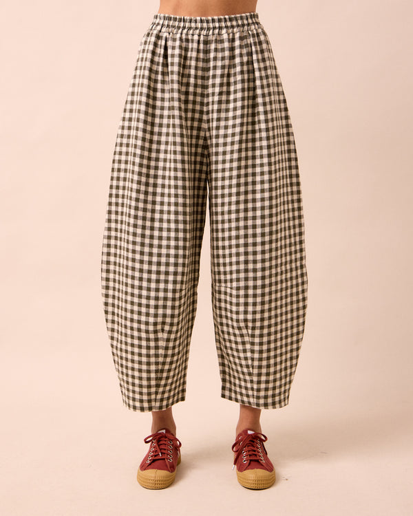  model wears daisy olive gingham linen trousers front