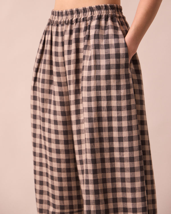 model wears daisy stone gingham linen trousers detail