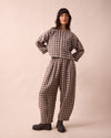 model wears daisy stone gingham linen trousers front
