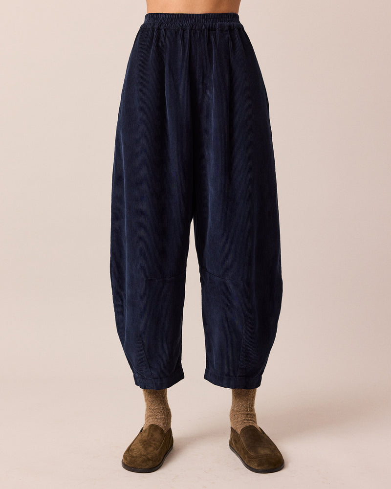 model wears daisy navy cord trousers front