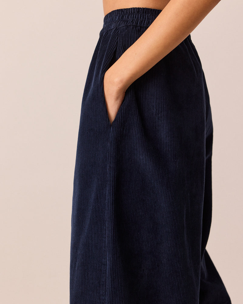 model wears daisy navy cord trousers