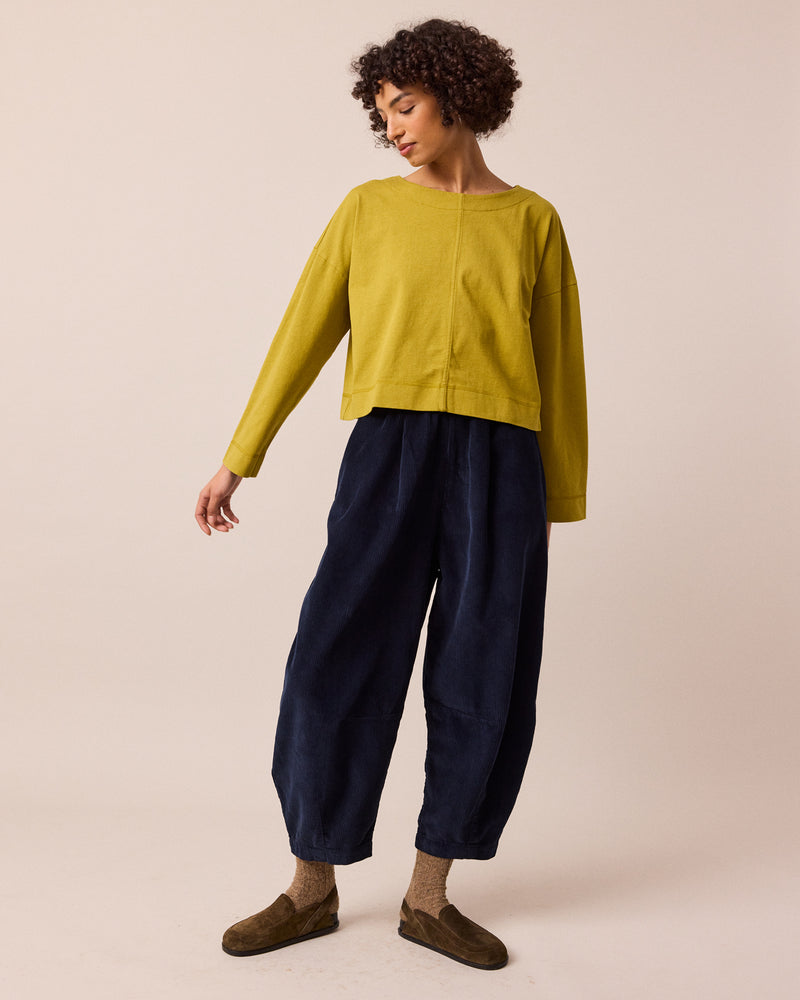 model wears daisy navy cord trousers right