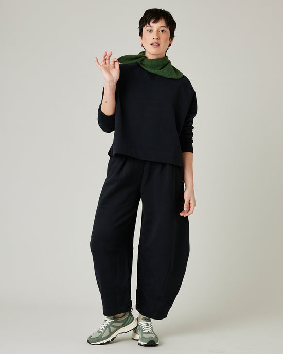 model wears black daisy jersey trousers