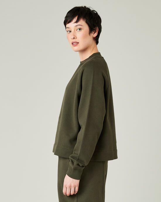 model wears olive noa jersey side 