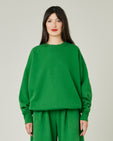 model wears juniper green jersey riley jumper