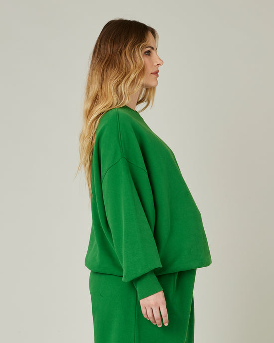 pregnant model wears juniper green jersey riley jumper