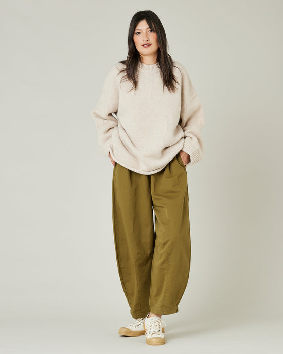 model wears Sicilian green daisy twill trousers 