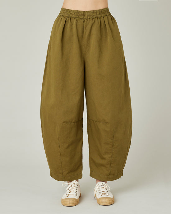 model wears Sicilian green daisy twill trousers front