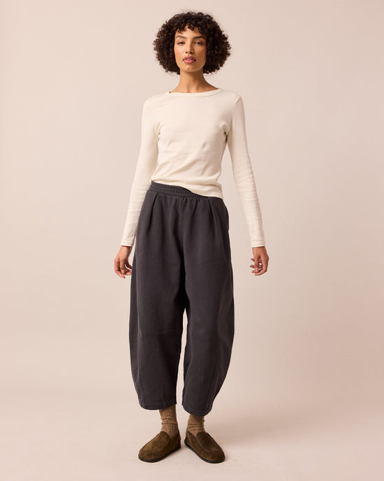 model wears daisy slate fleeceback jersey trousers right