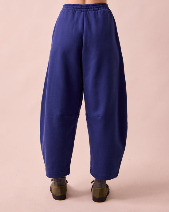 model wears daisy french blue fleeceback jersey trousers back
