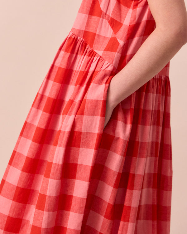 model wears dakota pink lemonade cotton linen dress
