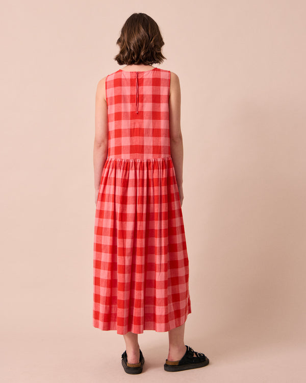 model wears dakota pink lemonade cotton linen dress