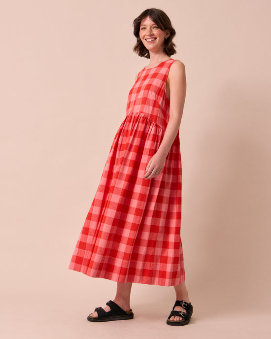 model wears dakota pink lemonade cotton linen dress