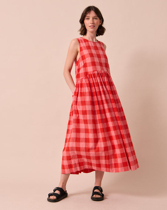 model wears dakota pink lemonade cotton linen dress