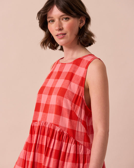 model wears dakota pink lemonade cotton linen dress