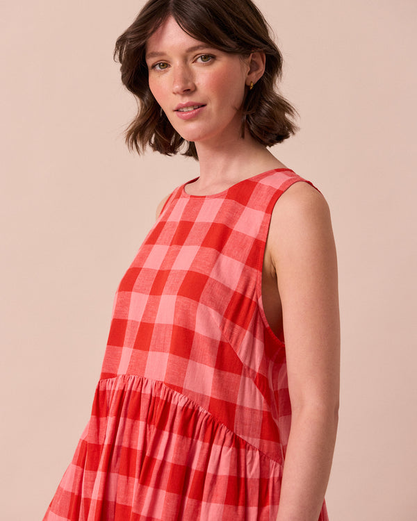 model wears dakota pink lemonade cotton linen dress