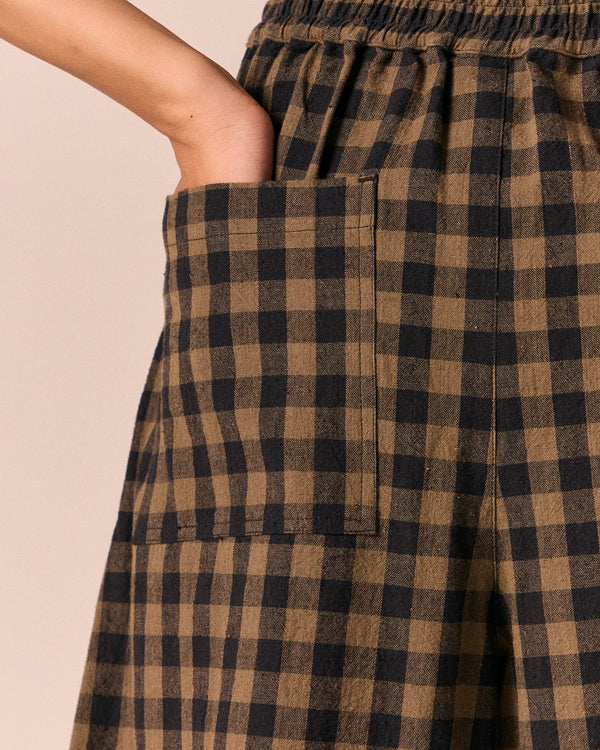 moodel wears dana dark olive gingham linen trousers 