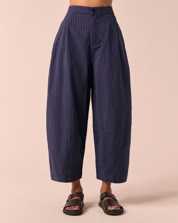 model wears dana midnight pinstripe cotton linen trousers front