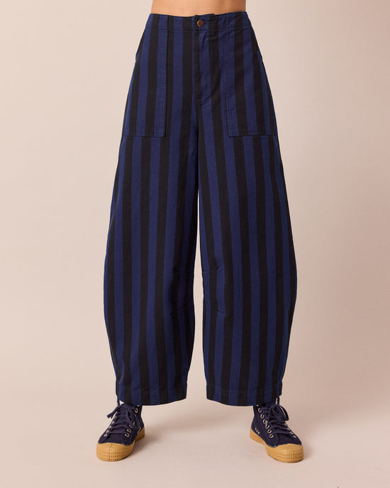 model wears dani blue and black stripe denim jeans front