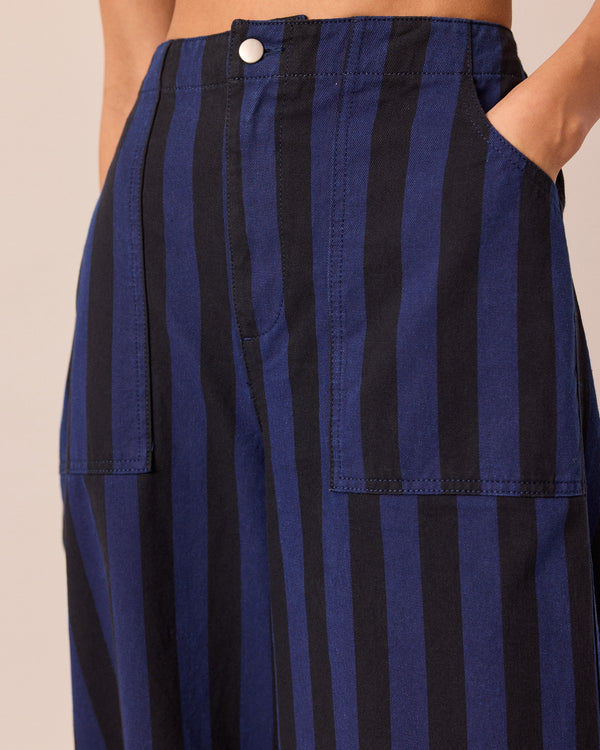 model wears dani blue and black stripe denim jeans