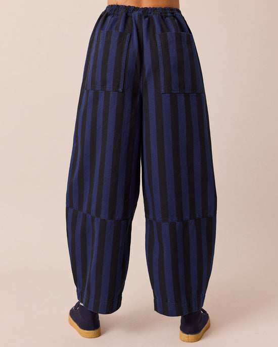 model wears dani blue and black stripe denim jeans back