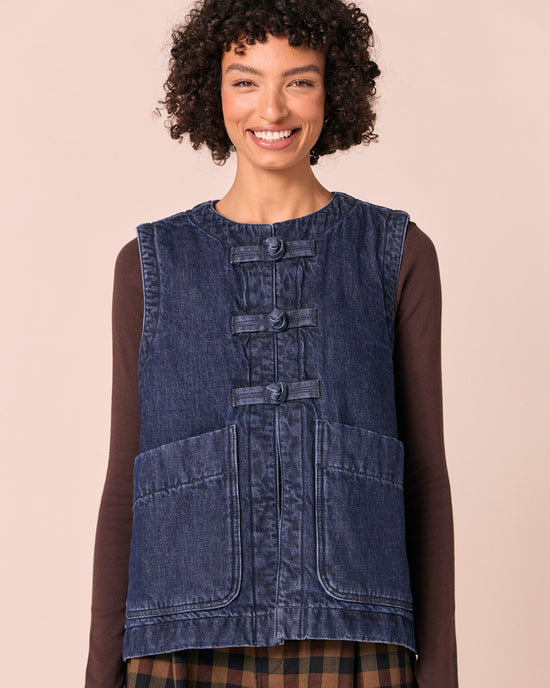 model wears delina deep blue denim gilet