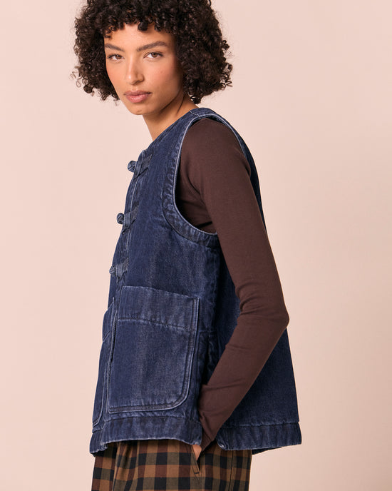 model wears delina deep blue denim gilet