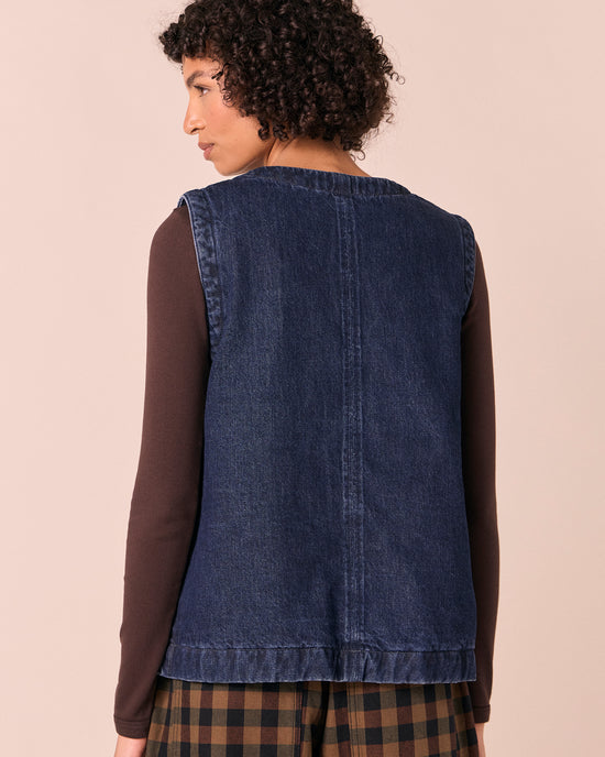 model wears delina deep blue denim gilet