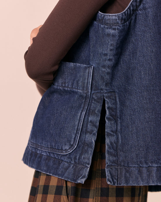 model wears delina deep blue denim gilet