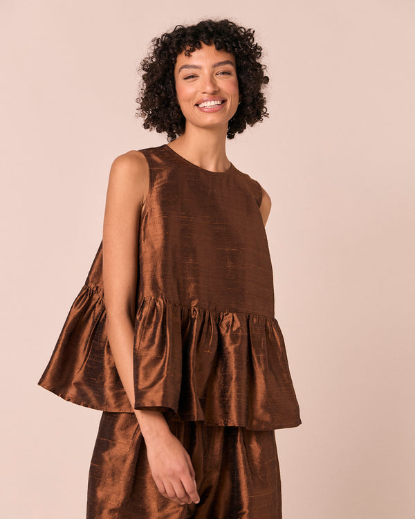 model wears demi pecan silk dupion top