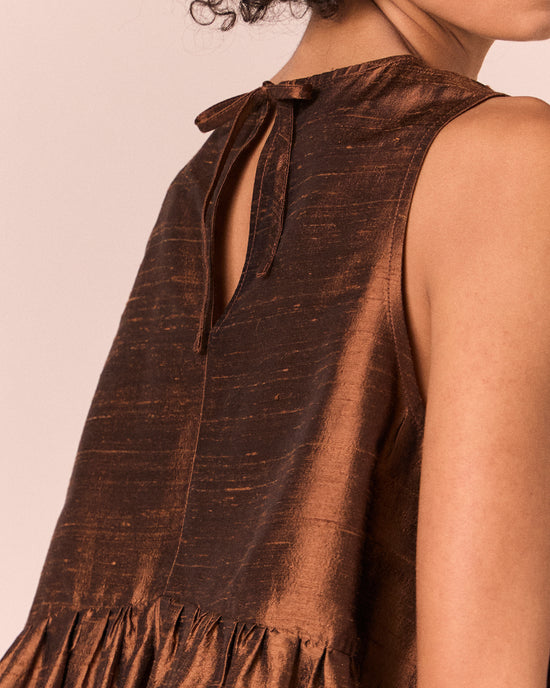 model wears demi pecan silk dupion top
