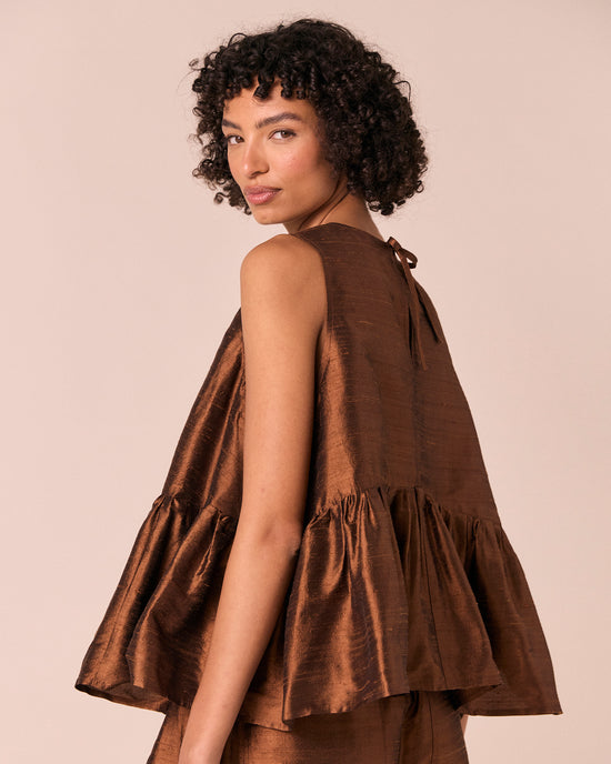 model wears demi pecan silk dupion top