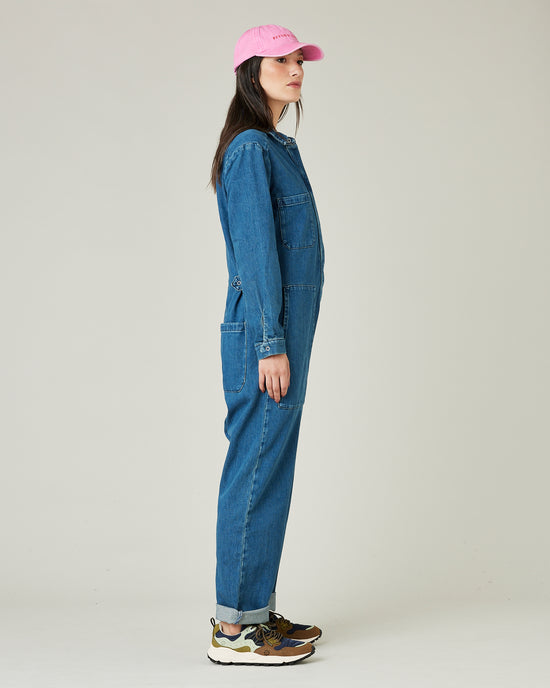 model wears mid blue denim coverall