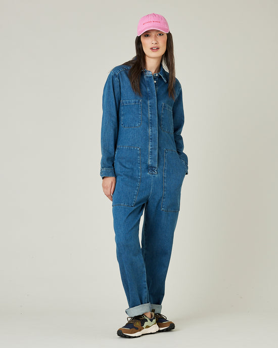 model wears mid blue denim coverall