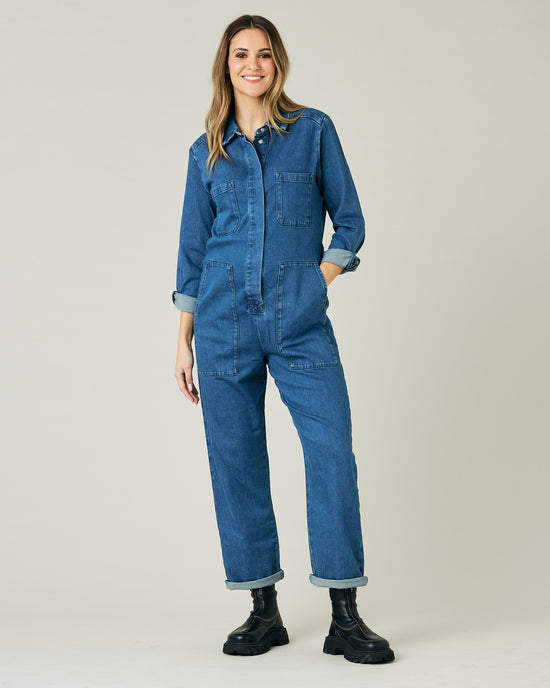 pregnant model wears mid blue denim coverall