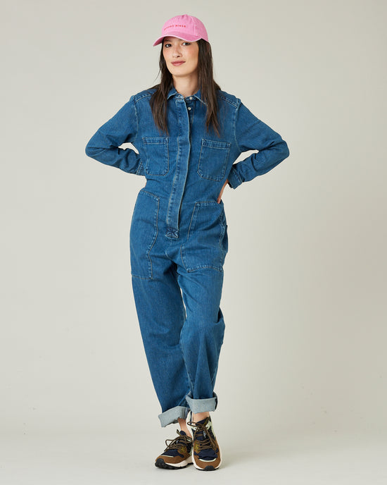 model wears mid blue denim coverall