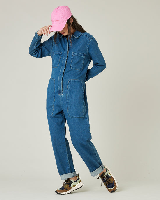 model wears mid blue denim coverall