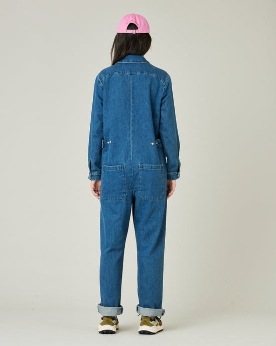 model wears mid blue denim coverall