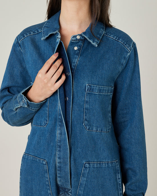 model wears mid blue denim coverall