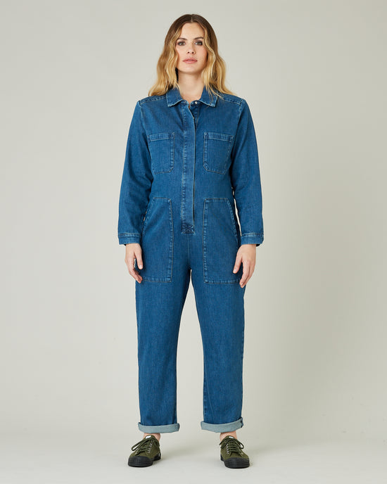 pregnant model wears mid blue denim coverall