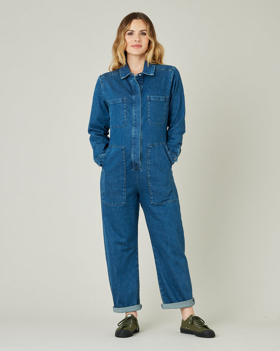 pregnant model wears mid blue denim coverall