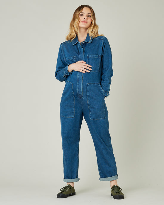 pregnant model wears mid blue denim coverall