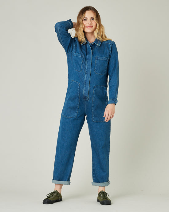 pregnant model wears mid blue denim coverall