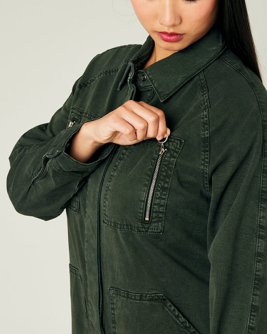 model wears sea green hallie coverall